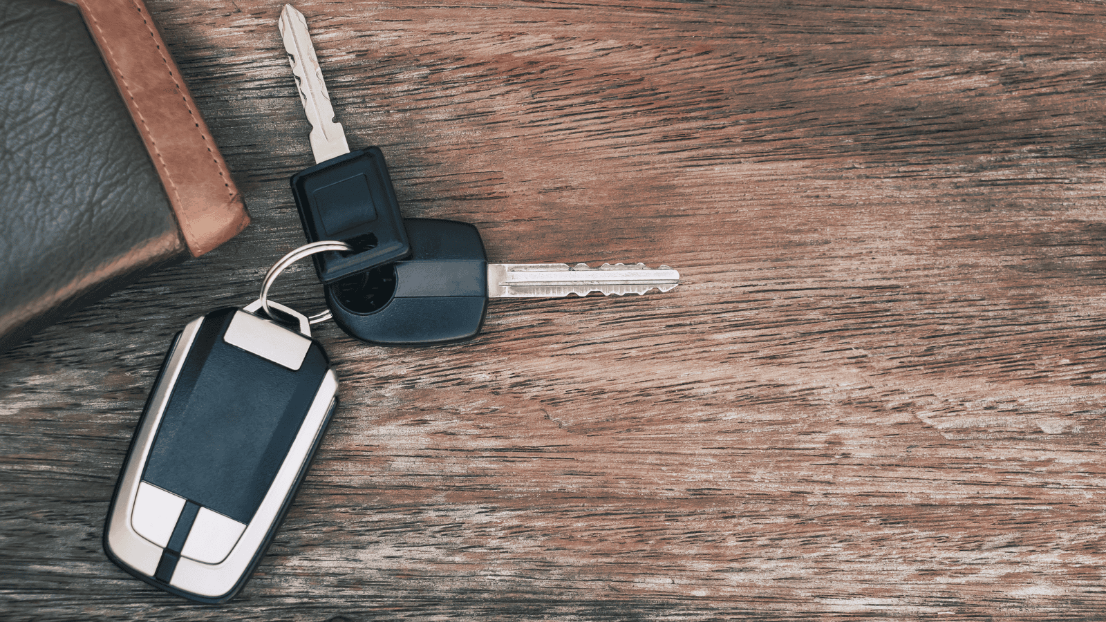 car keys on wooden desktop